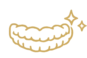 Dental aligners in a set, showcasing clear, custom-made trays designed for gradual teeth alignment, emphasizing a discreet orthodontic solution for improved smile aesthetics and bite function.